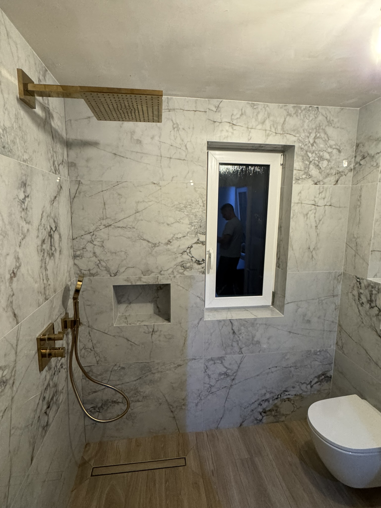 Marble-tiled bathroom finished by Mark & Patryk Property Maintenance